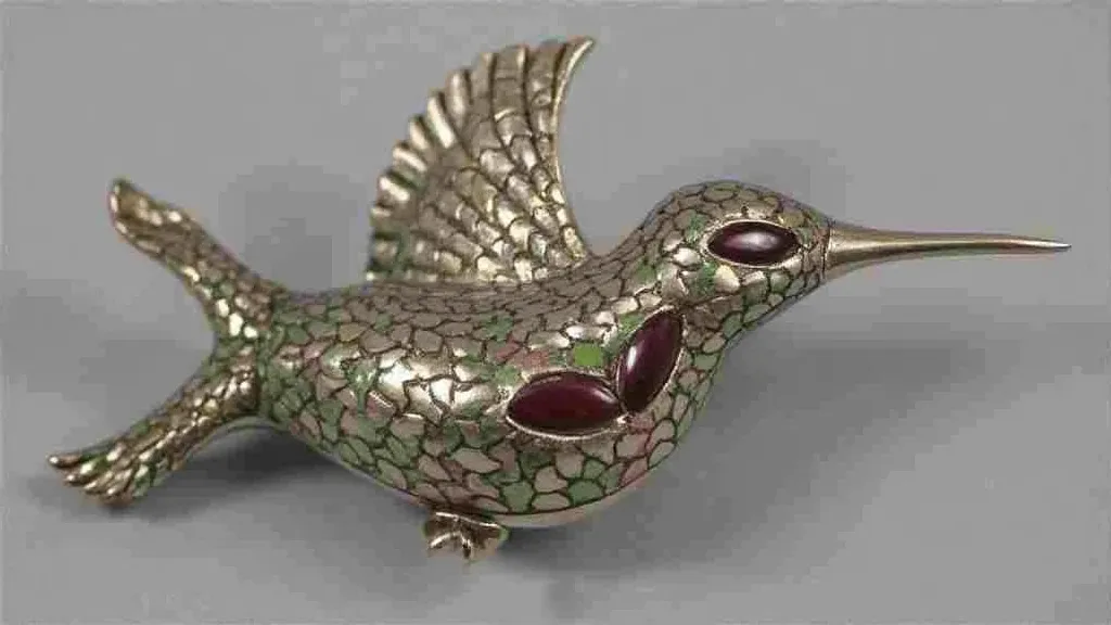 Antique hat pin with a hummingbird design